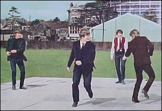 The Beatles cavort in good fun in an empty field in their first feature film, A Hard Day's Night.