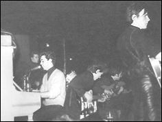 The Beatles playing at the Top Ten Club in Hamburg, Germany. Left to right: Paul McCartney, George Harrison, John Lennon and Stu Sutcliffe.
