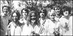 The Beatles in India studying meditation. Pictured left to right: unidentified woman, John Lennon, Paul McCartney, Maharishi Mahesh Yogi, George Harrison, Mia Farrow, unidentifed man, Donovan.