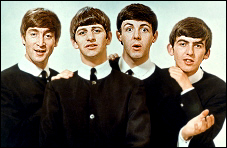 The Beatles in magazine pinup during the height of Beatlemania.
