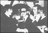 The Beatles help Roy Orbison belatedly celebrate his birthday. Left to right: John Lennon, Roy Orbison, (person unknown), Ringo Starr.