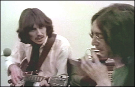 George Harrison and John Lennon in the recording studio during the making of their Abbey Road album.