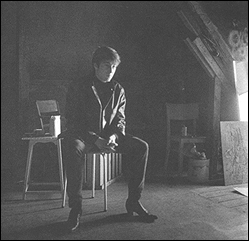 John Lennon poses for Astrid Kirchherr in the attic where his best friend, Stu Sutcliffe, had recently died of a brain hemmorage.