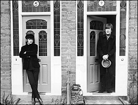 Ringo Starr and John Lennon wait for their cue to begin a scene for their movie, Help!