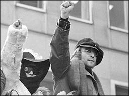 John Lennon and Yoko Ono join a protest on the streets of New York City.