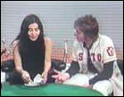 Yoko Ono finishes her happening, Mend Piece, as John Lennon looks on, during the Mike Douglas Show, February 18, 1972.