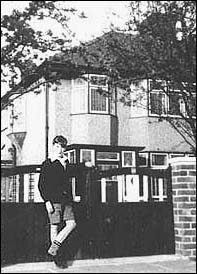 A young John Lennon poses outside his family home in Liverpool, England, circa 1950s. John lived here with his Aunt Mimi until he left home to tour the world as one of The Beatles. The house is known as Mendips and is now a major tourist attraction for fans around the world.