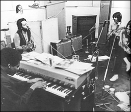 The Beatles in Abbey Road Studios recording Let It Be. Pictured bottom left is keyboardist, Billy Preston, who was invited to sit in on some of the sessions.