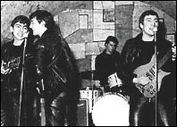 The Beatles playing at the Cavern in the early 1960s.