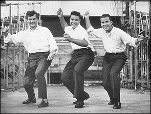 Conway Twitty, Chubby Checker and Dick Clark demonstrate the latest dance craze, the Twist.