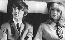 George Harrison and Pattie Boyd wait for the next scene to be filmed in A Hard Day's Night. They met on the movie set and were married about two years later.