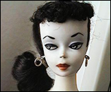 The beautiful Barbie doll. This one is a Brunette No. 1 Ponytail which sells for thousands of dollars today.