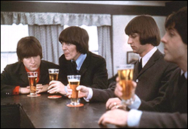 The Beatles gather at a pub in a scene from their movie Help!