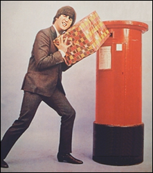 John Lennon tries in vain to put a Christmas present into a British letterbox. 