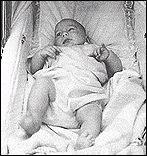 Baby Julian Lennon, John Lennon's first son, in his bassinet in London, England. John nicknamed him Sausage.