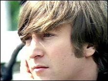 A closeup of John Lennon from the Beatles promotional film for the song Rain.