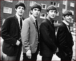 The Beatles all in a row in an early photo from 1963. Left to right: Paul McCartney, George Harrison, John Lennon and Ringo Starr.