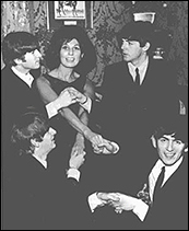 The Beatles with British singer Alma Cogan.