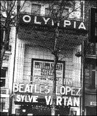 The marque of the Olympia Theatre in Paris, France. It announces the appearance of The Beatles and others on the bill; Trini Lopez and Sylvie Vartan. The Fab Four played at this venue just prior to going to America in February 1964 to appear on The Ed Sullivan Show.