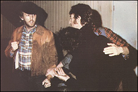 John Lennon (right) and Harry Nilsson (left) appear to be in a fight outside the Troubadour nightclub in Santa Monica, California. They were physically expelled from the club for causing a fracas inside.