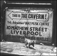 A sign on a Liverpool, England street points to the Cavern Club, where The Beatles played over 230 performances in the early 1960s.