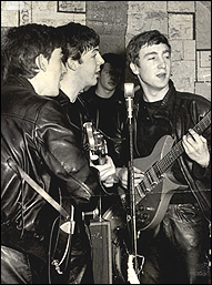 The Beatles performing at the Cavern Club in Liverpool, England, circa 1961. Left to right: George Harrison, Paul McCartney and John Lennon.